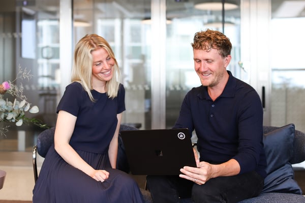woman-and-man-looking-at-computer