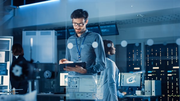 man-with-ipad-in-control-room