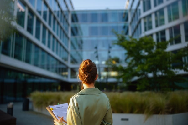 woman-standing-outside-office-building